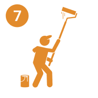 10 A man holding a broom and standing next to a clock.
