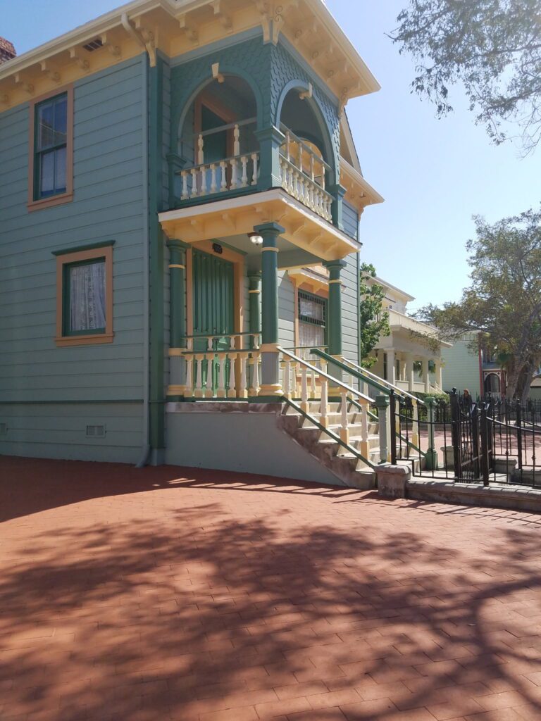 A house with steps leading to the front door.