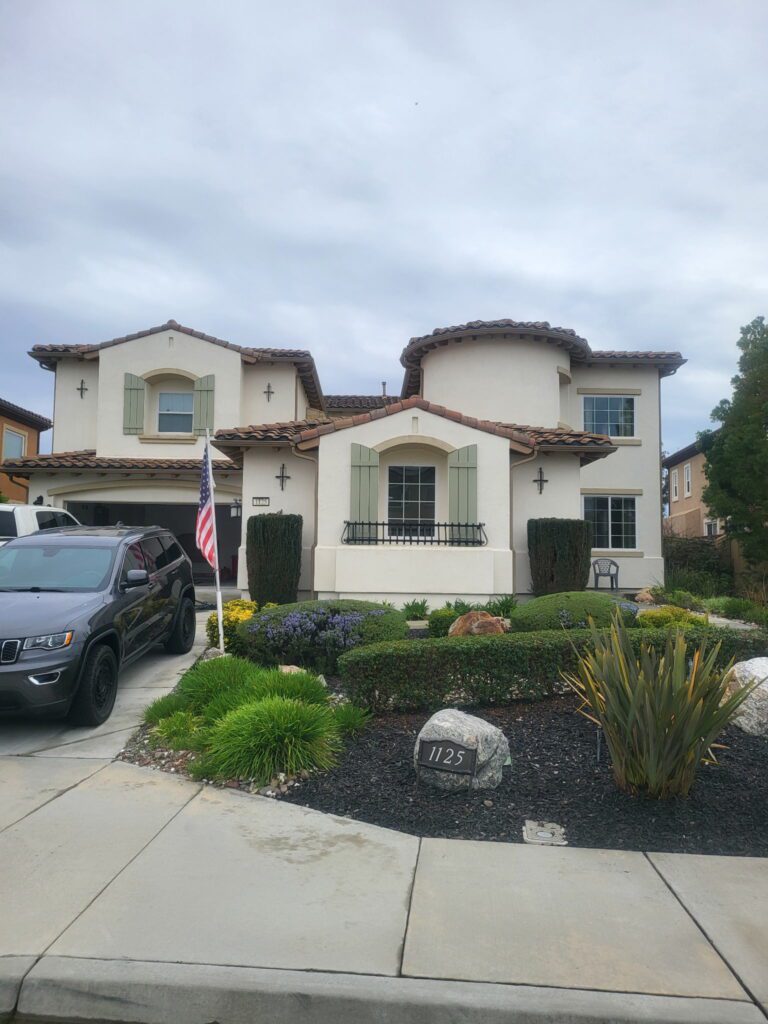 A house with a lot of landscaping in front